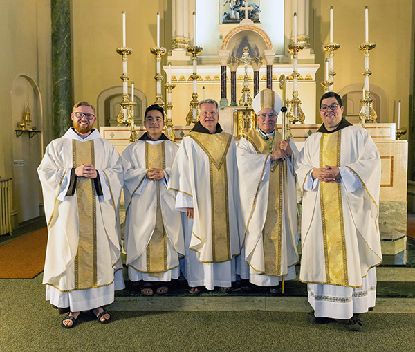 Photo of newly-ordained priests with Provincial Minster Mark Joseph Costello and Bishop Jeffrey Haines