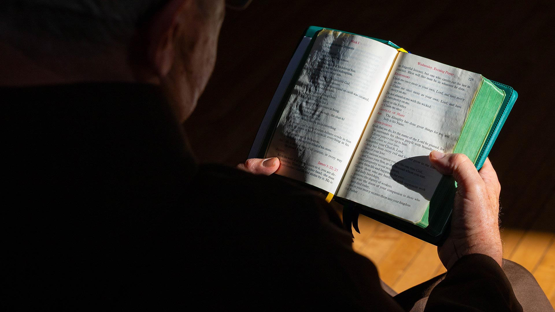 Br. Kent Bauer prays the Divine Office with a close-up of the Breviary.