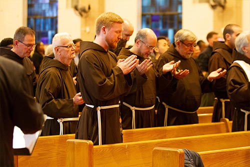Capuchin friars in prayer